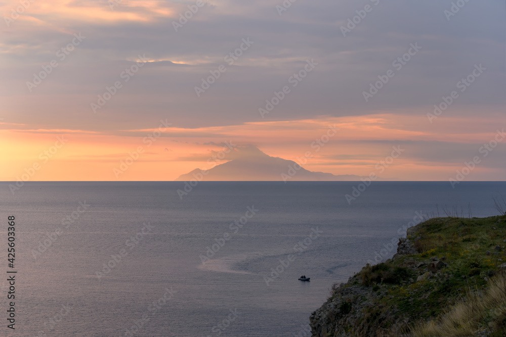 Sunset in the Aegean Sea. From the island of Lemnos in Greece with the background of the Athos peninsula. ( Mount Athos)