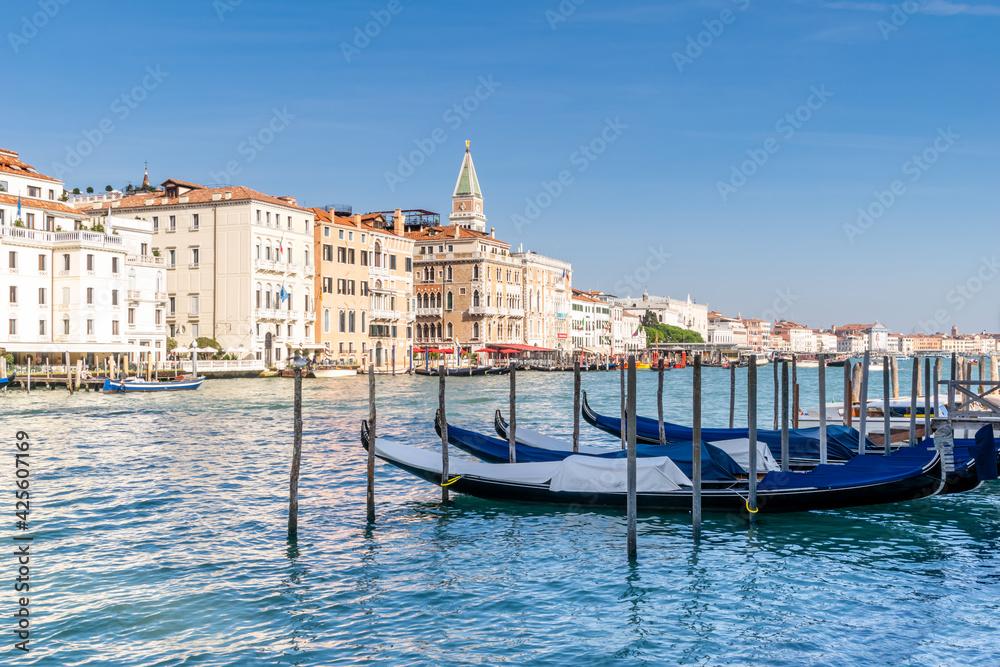 Gondolas on the edge of the Grand Canal, Venice, Italy