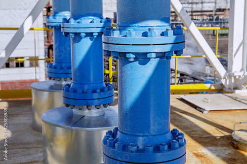 Wallpaper Mural The connection of two pipes with large bolts and nuts. Closeup on metal construction at factory. Elements of manufacturing equipment.  Torontodigital.ca