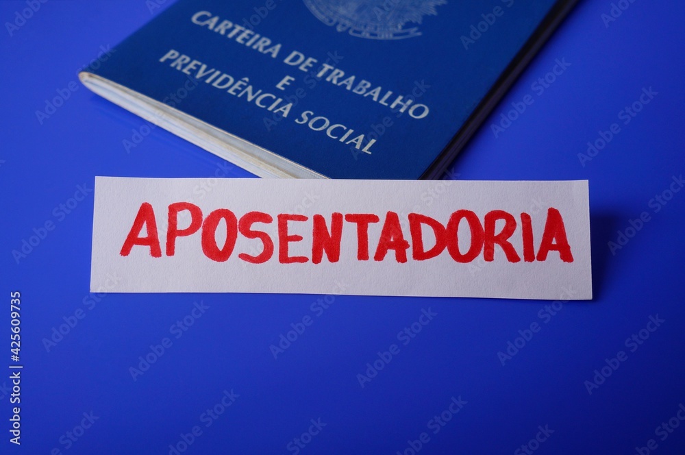 Brazilian Work Card and Aposentadoria (Retirement) written in a note. Retirement in Brazil concept.