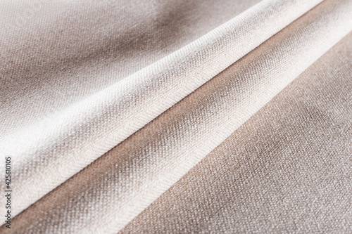 cream-colored dense upholstery fabric with linen texture, pleated drapery