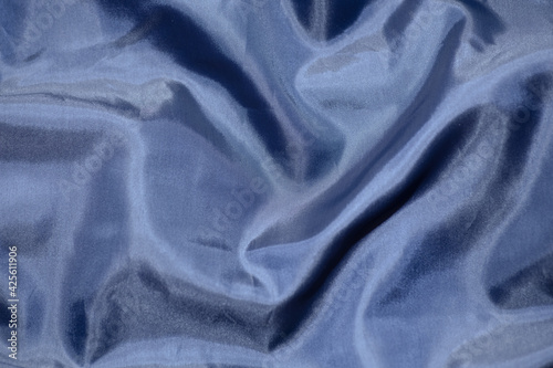 blue lining fabric, fabric texture, soft folds, center focus