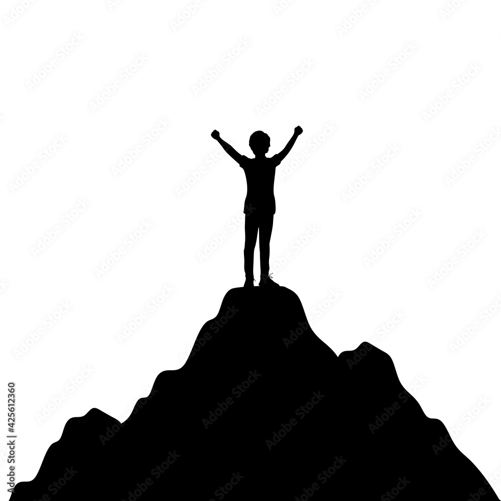 Silhouette boy standing with raised hands in mountains