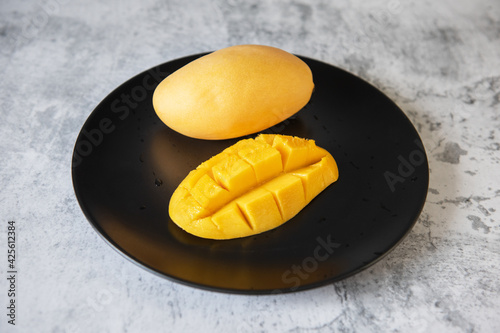 Fresh yellow mango fruit in...