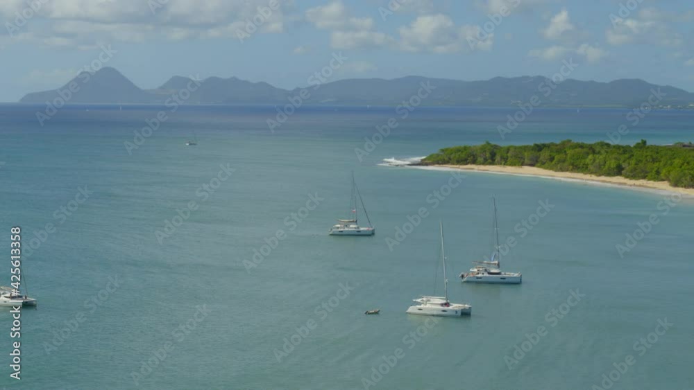 Aerial of boats moored in calm sea and forest near coast Aerial of boats moored in calm sea and forest near coast