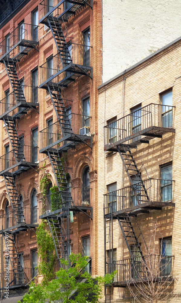 Old buildings with fire escapes, New York City, USA.