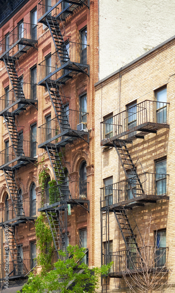 Fototapeta premium Old buildings with fire escapes, New York City, USA.