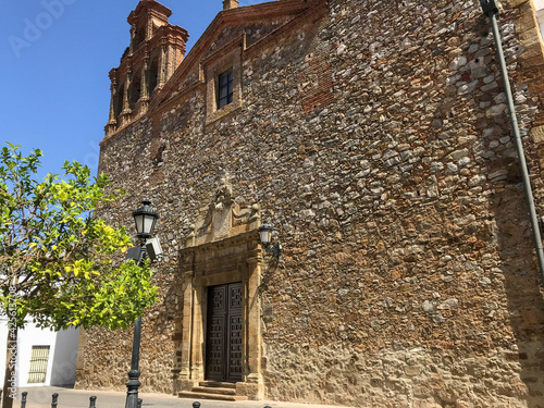 Llerena, Spain; 09 02 2019: This is the facade of the Iglesia Mayor de Nuestra Señora de la Granada located in the center of Llerena.