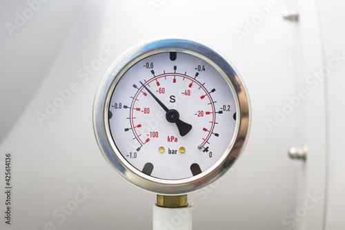 Vacuum pressure gauge meter details.Vacuum pressure gauge, part of vacuum chamber in laboratory.