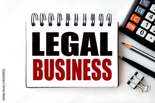 Fotografi LEGAL BUSINESS. Text on white notepad paper on light background