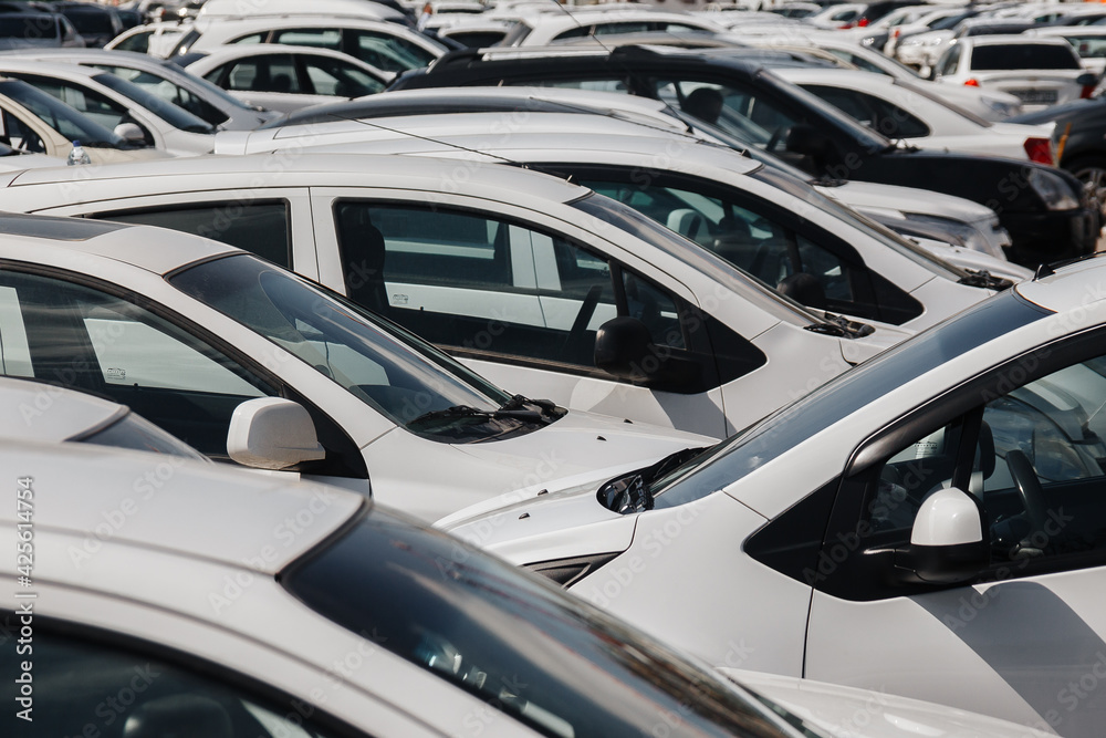 Lots of cars parking in the city