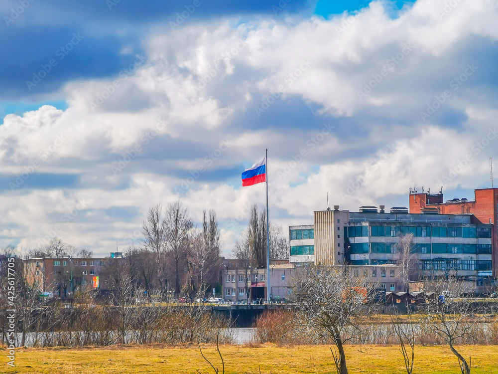 Russian flag on a high mast in Kaliningrad seen from Lithuanian Republic Russian flag on a high mast in Kaliningrad seen from Lithuanian Republic