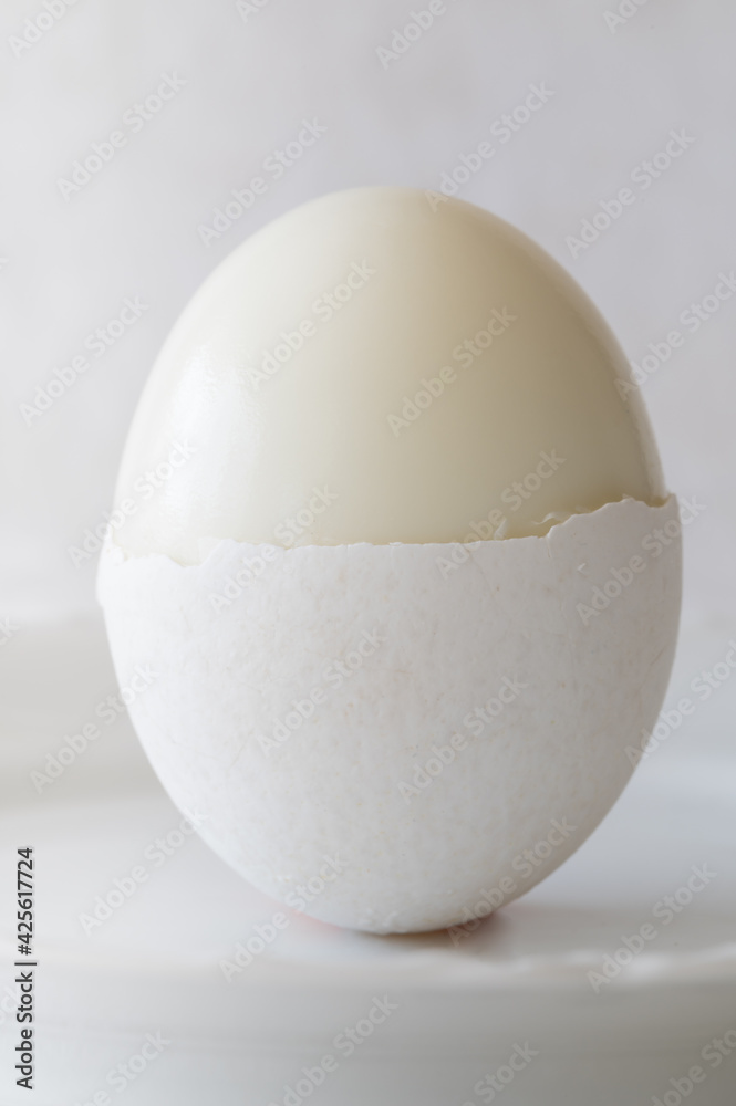 Hardboiled Egg with Half a Shell Hardboiled Egg with Half a Shell