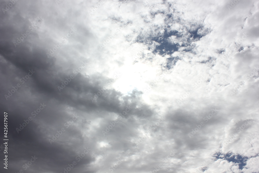 Obraz premium white puffy clouds with a blue path 