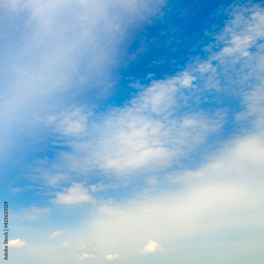 Obraz premium Blue sky and white, soft clouds.