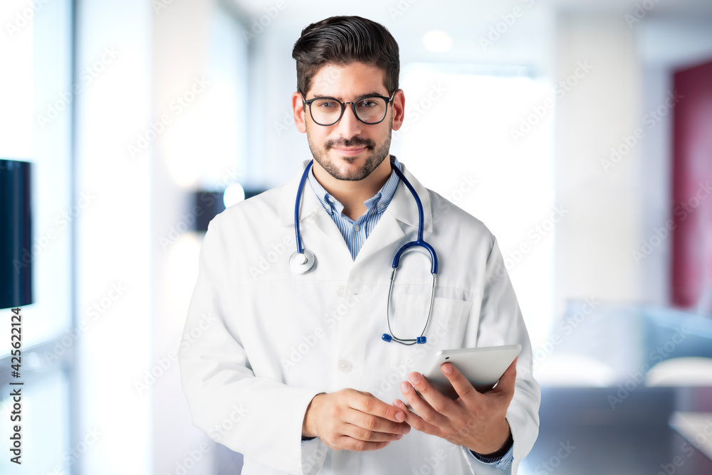Smiling male doctor portrait in the hospital Smiling male doctor portrait in the hospital