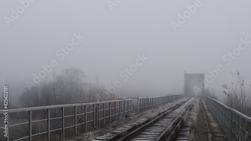 Heavy fog on the railway bridge, autumn landscape wallpaper