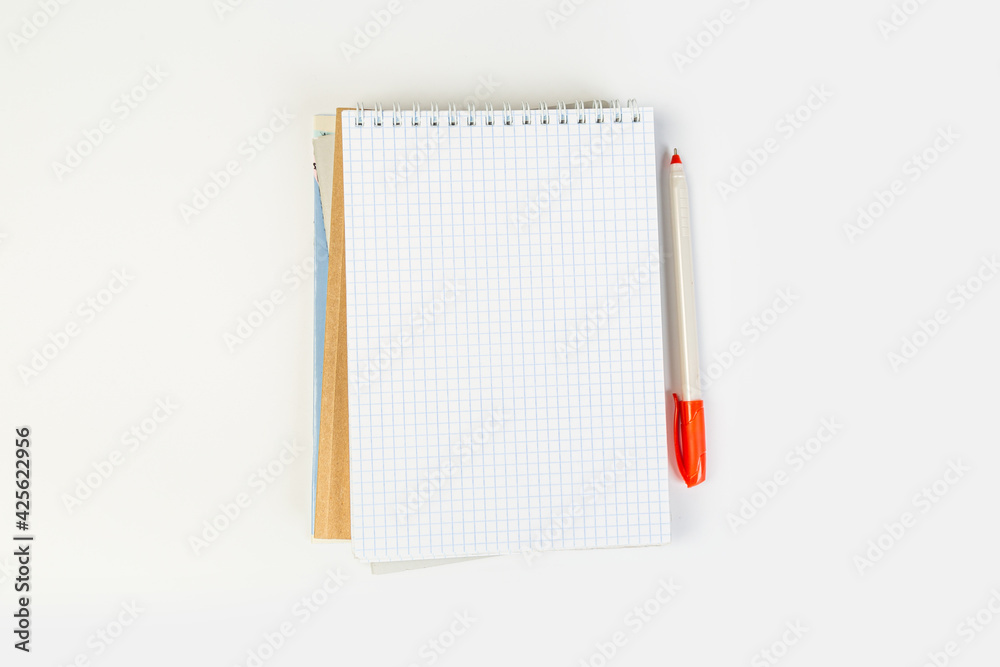 top view of an open notebook with a pen on a gray background, school notebooks with a spiral spring, office notepad. desktop concept, learning top view of an open notebook with a pen on a gray background, school notebooks with a spiral spring, office notepad. desktop concept, learning