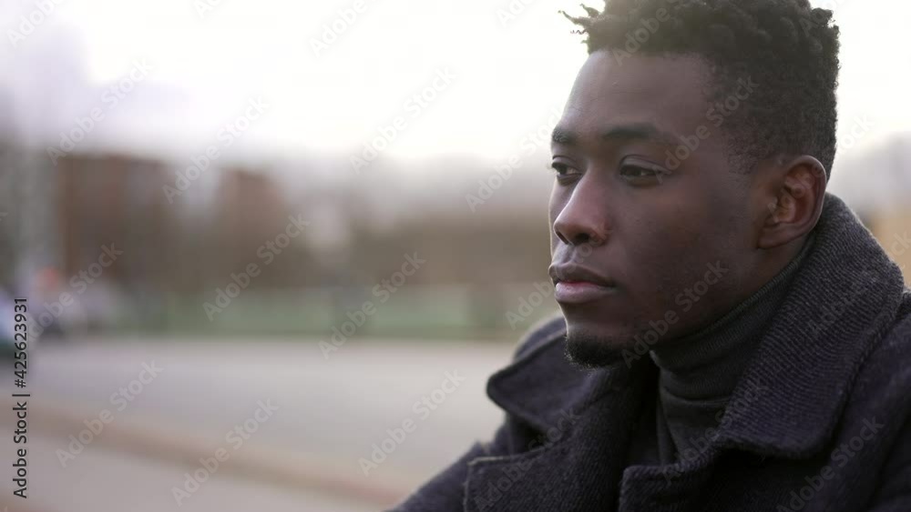 Pensive black African man thinking about life, thoughtful expression