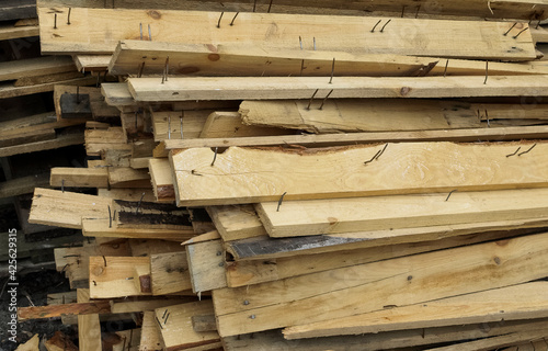 Pile of planks with nails