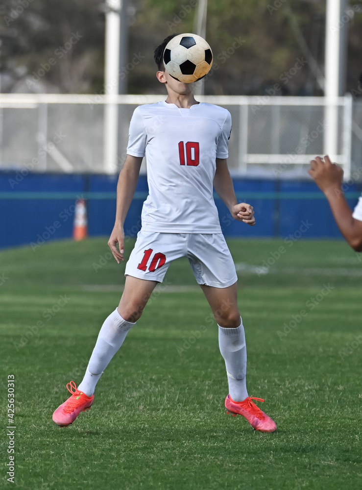 Young athletic boy making amazing plays during a soccer match Young athletic boy making amazing plays during a soccer match