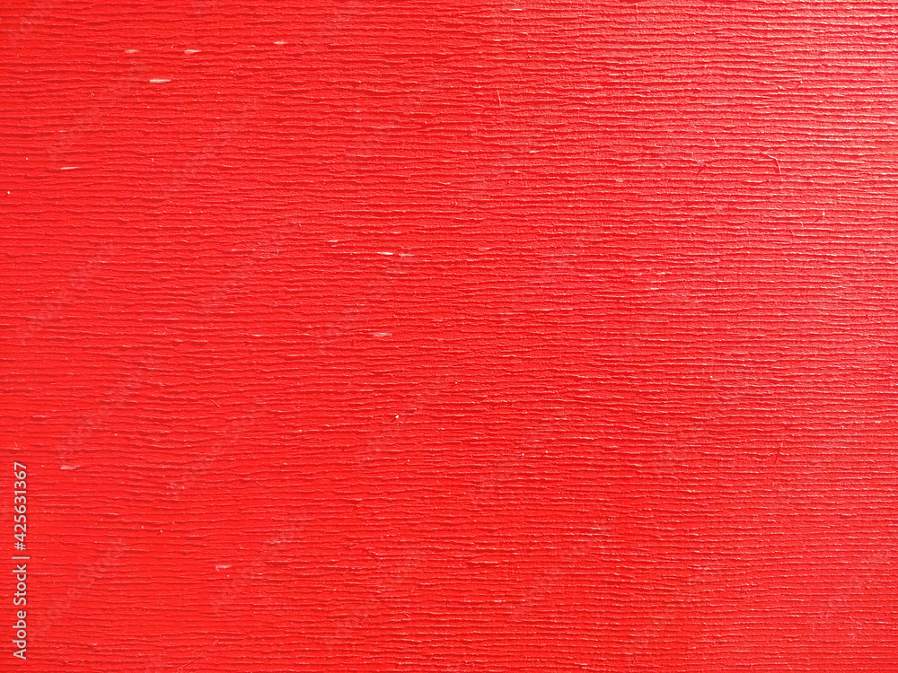 Fototapeta premium Selective focus old red cracked paint. The texture of the old gules paint with cracks. Dried in the sun and cracked color on the wall of house.
