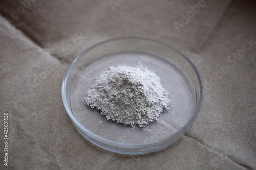 Canvas-taulu A small pile of white gypsum in a petri dish.