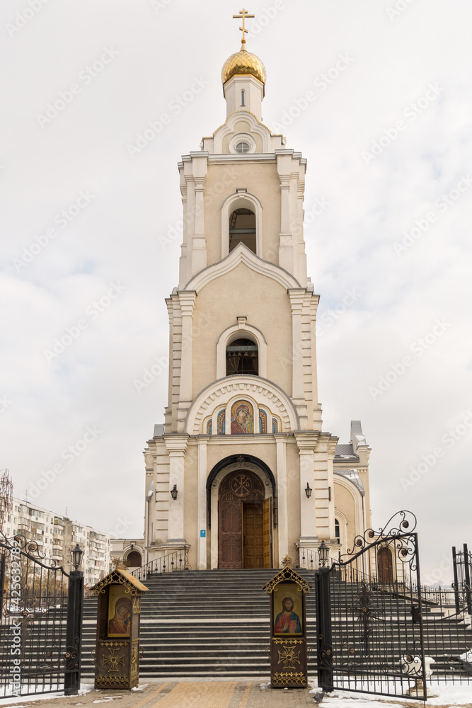 tall and light Orthodox church with a golden dome