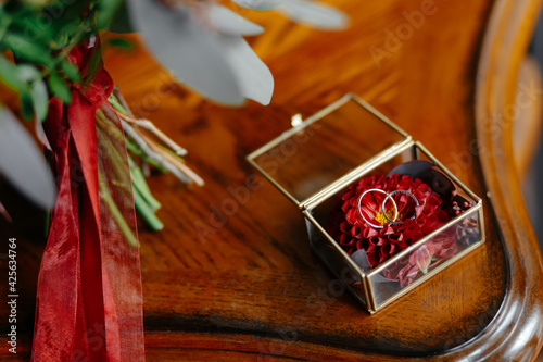 Wedding rings in a beautiful glass box on the table