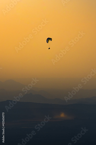 paragliding at sunset