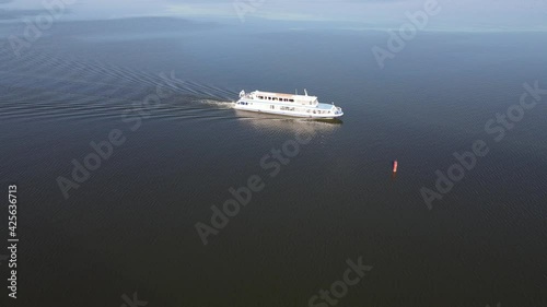 Aerial view of the old lighthouse by the green muddy flowered water photo