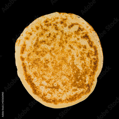 pancake isolated on black background, top view