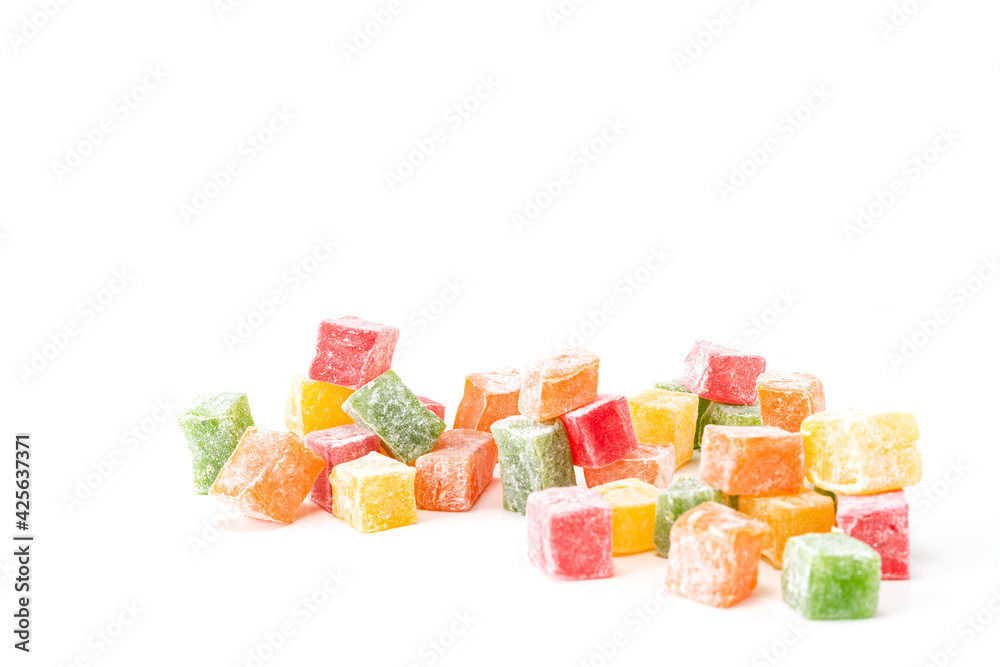 Multicolored cubes of rahat lukum on a white background Multicolored cubes of rahat lukum on a white background