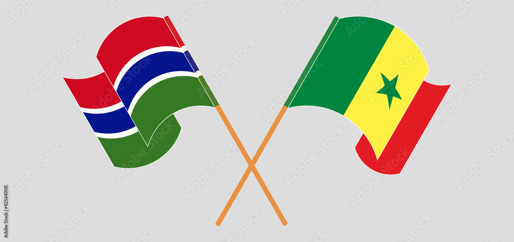 Crossed and waving flags of the Gambia and Senegal Crossed and waving flags of the Gambia and Senegal