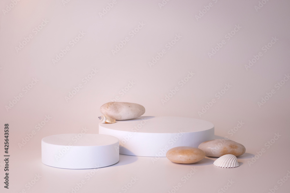 White podium on the white background. Podium for product, cosmetic presentation. Creative mock up. Pedestal or platform for beauty products. White podium on the white background. Podium for product, cosmetic presentation. Creative mock up. Pedestal or platform for beauty products.