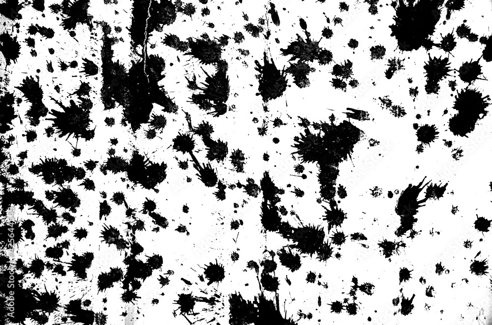 Abstract white concrete wall or floor with black paint blotches, cracks