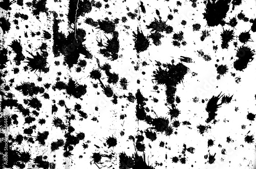 Abstract white concrete wall or floor with black paint blotches  cracks