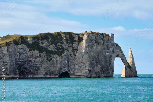 The cliffs of Etretat with it natural arch "Pont daval" and its needle "Aiguille d'Etretat".