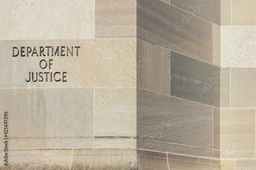 Fényképezés Department of Justice on the side of a marble walled building in Washington, D
