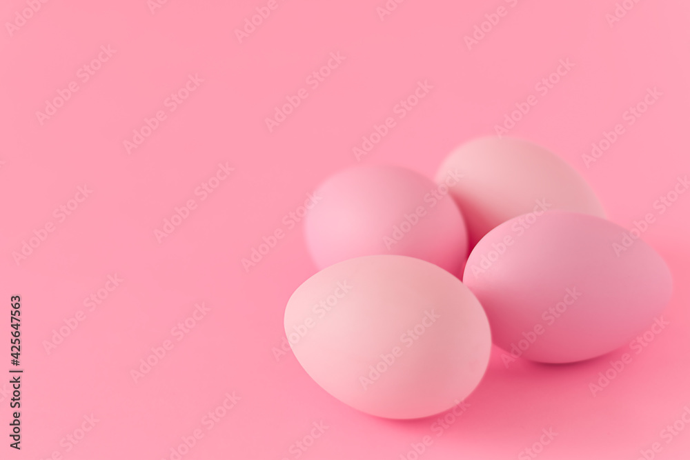 Minimal pink Easter eggs on pink background