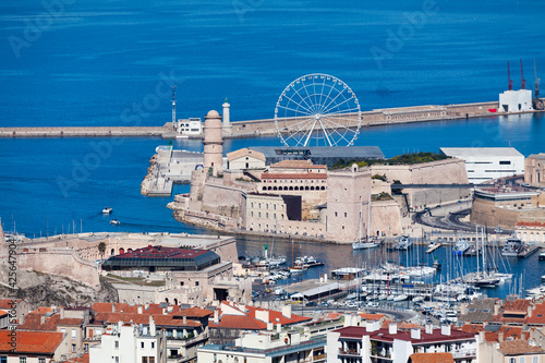The Vieux port of Marseille with on one side, the Fort Gentaume and on the other side, the Fort Saint-Jean with its Tour du fanal and Tour du Roi René as well as the Phare de Sainte Marie.