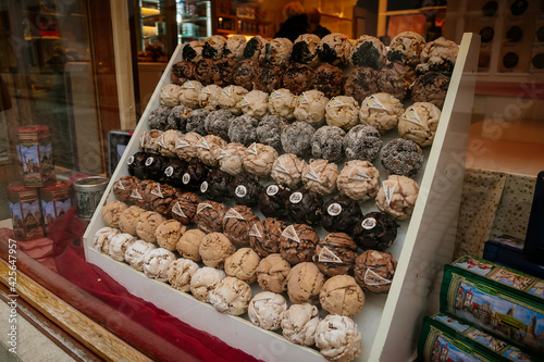 Famous Bavarian pastry Snowball, Schneeball or Schneeballen pastry with powdered and cinnamon sugar, a local specialty for sale at bakery cafe, Rothenburg ob der Tauber, Germany photo