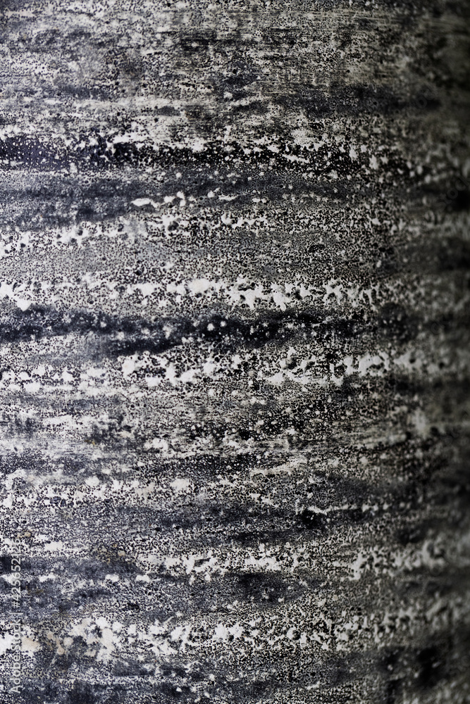 Grunge abstract background. Dirt textured surface. List of roofing felt close-up. Ruberoid texture.