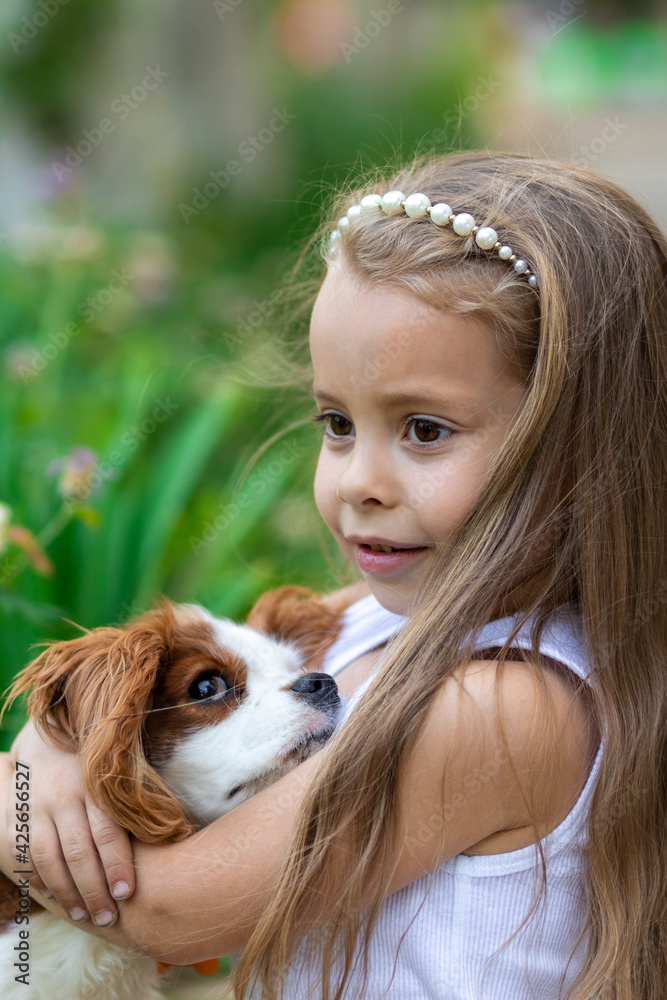 Girl hugging her favorite dog outdoors Girl hugging her favorite dog outdoors