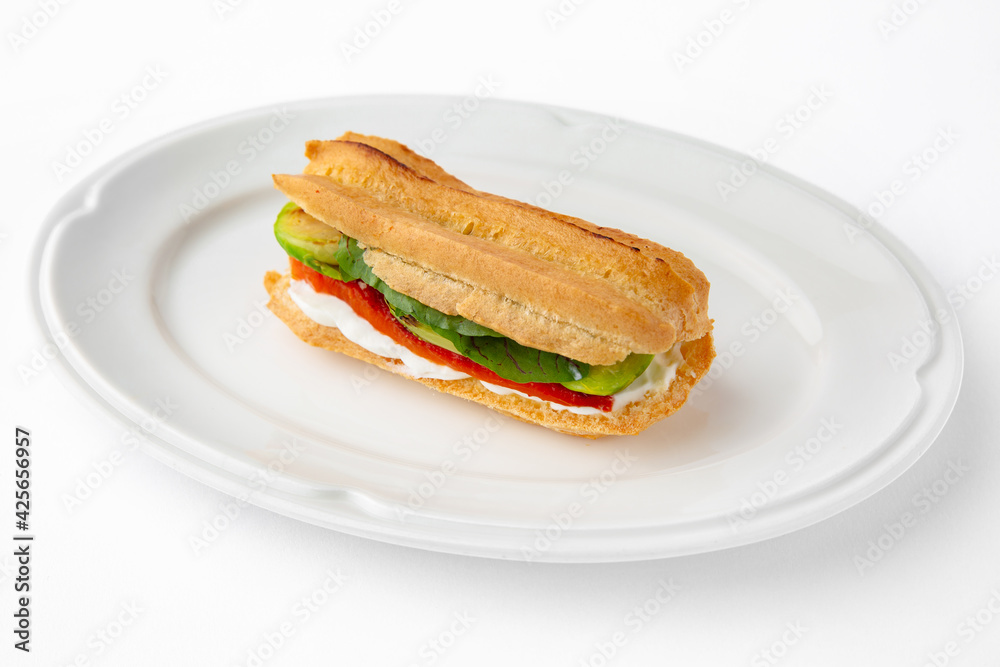 Vegetarian mini sandwich with cheese, tomato, cucumber, zucchini. Beautifully decorated catering banquet menu. Food snacks and appetizers for buffet. Isolated on white background Vegetarian mini sandwich with cheese, tomato, cucumber, zucchini. Beautifully decorated catering banquet menu. Food snacks and appetizers for buffet. Isolated on white background