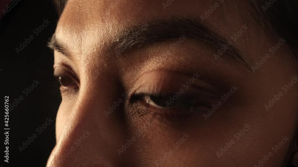 The Eyes of a woman - extreme close up shot - studio shooting The Eyes of a woman - extreme close up shot - studio shooting