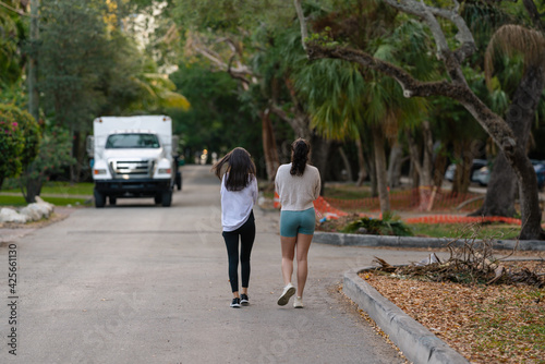 women's walking street sport morning tree outdoor fitness Miami Florida 