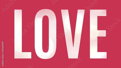 Large word Love with lights moving in the letters, isolated on pink background. Graphic animation for e-card, celebration or invitation.