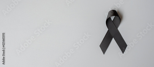 Melanoma and skin cancer, Vaccine injury awareness month and rest in peace concepts. black Ribbon on grey background