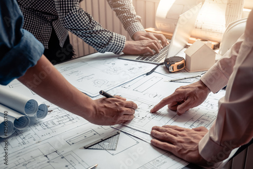 Architect and engineer man  concept collaboration point at the blueprint at the office.